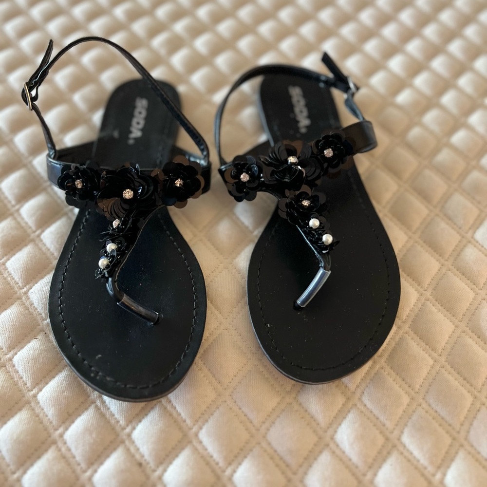Cute black sandals with floral accents